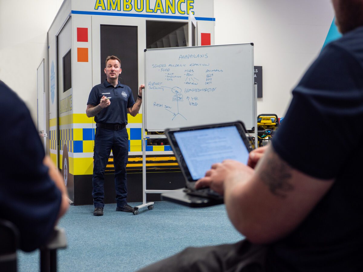 An image of an APC Trainer presenting at a Clinical Workshop